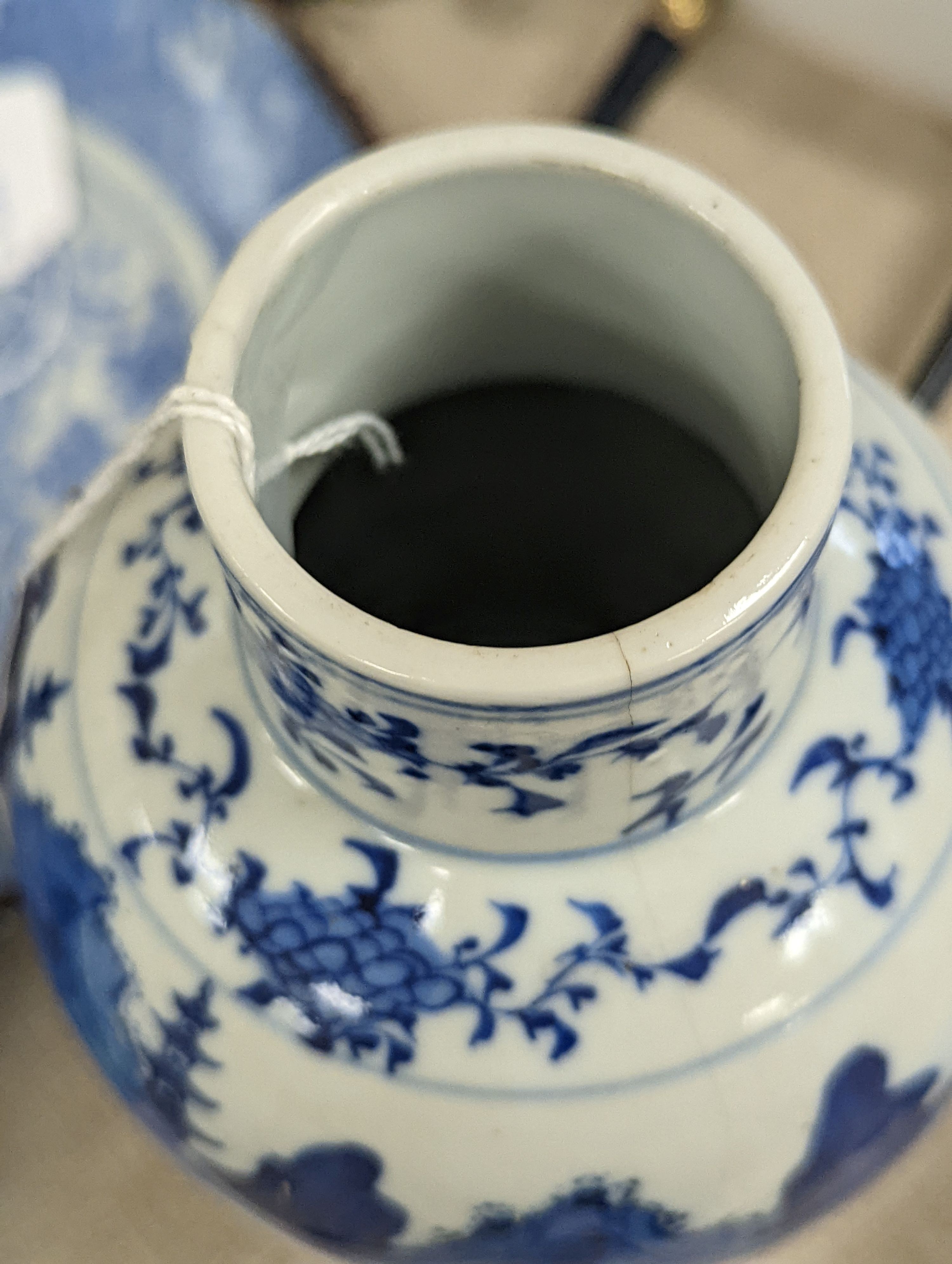 An early 20th century Chinese blue and white lidded vase together with a similar enamelled pottery vase and a Japanese blue and white dish. Tallest vase 29cm